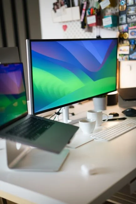 A tablet with a financial website open, alongside a white keyboard and mouse. Ideal for tech-theme stock images.